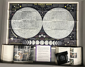 display box 1 with abig moon map and open books