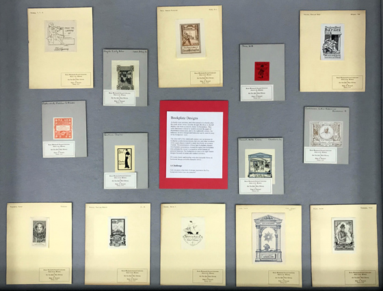 center display case, with bookplate designs that feature books and reading and a challenge