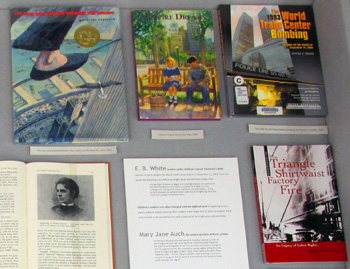 Part of display case one, showing these books: 
