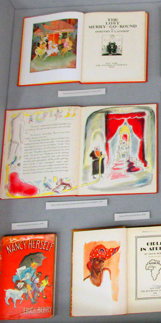 Part of display case 2, showing four books by Albany authors or illustrators: The Lost Merry-Go-Round, Many Moons, Nancy Herself, and Girls in Africa.