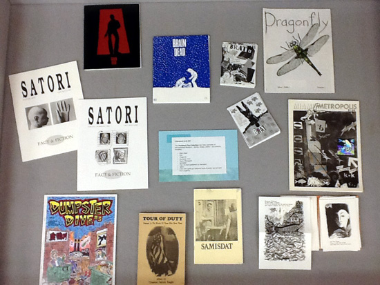 Left display case, with examples of zines focused on writing and art