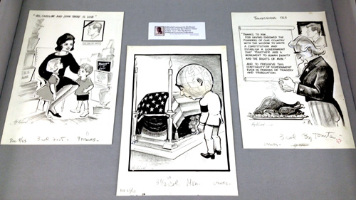 Right display case, containing three original political cartoons by Hy Rosen.