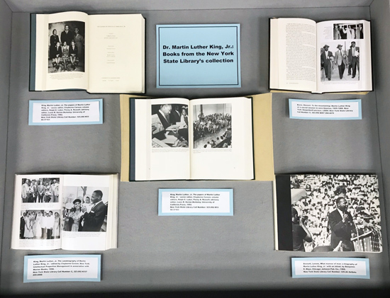 left case, with books showing photos of Martin Luther King with family and at events
