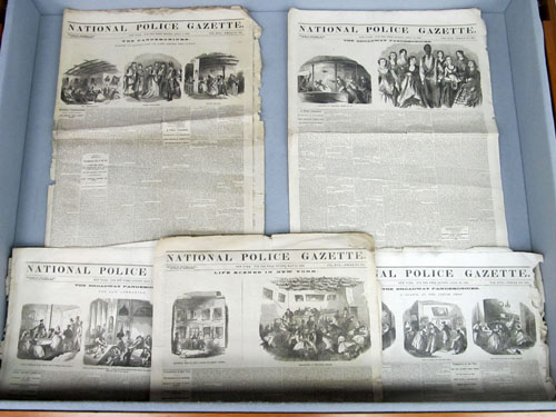 Display case 3, showing cover pages and illustrations from five issues of the National Police Gazette.