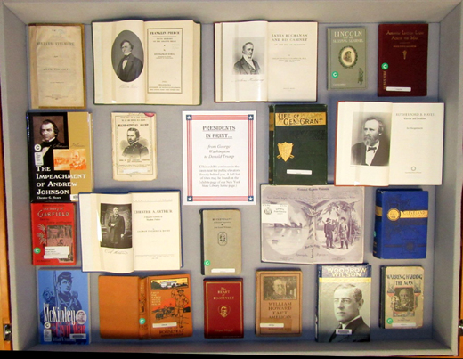 Center diplay case, with books on presidents from Fillmore to Harding