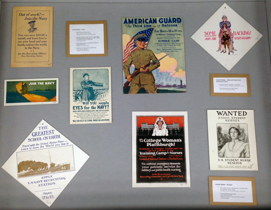 Right display case, with recruitment posters for the US Navy, for the National and American Guard, and for nurses.