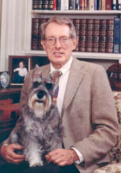 portrait of Joseph Shubert, seated with his dog.
