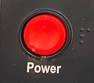 Round red button with Power in white white lettering and braille to the right of it